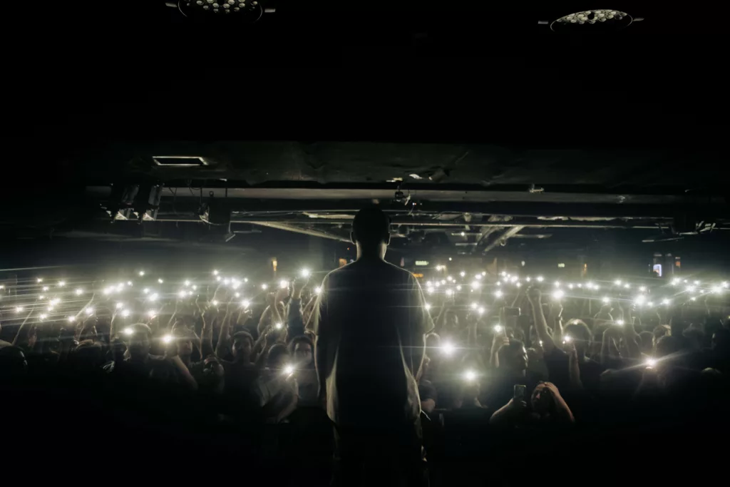 musician preparing to preform in front of a crowd